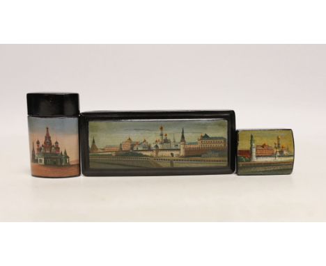 * * Two Russian lacquer ‘Kremlin’ stamp boxes and a similar vesta case, c.1900, largest 11cmPlease note this lot attracts an 