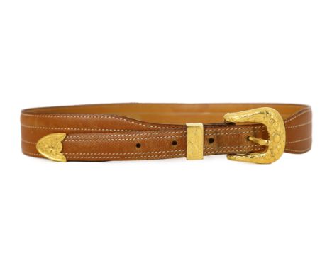 A Hermès lady's tan leather belt, with gold tone buckle and white stitching, size XS/Small***CONDITION REPORT***Scuffs and we