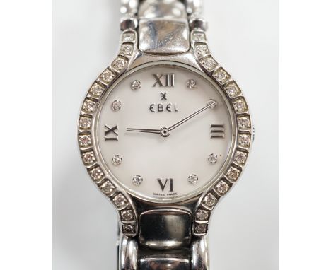 A lady's 2001 stainless steel Ebel quartz wrist watch, with diamond set bezel, mother of pearl dial and diamond dot markers, 