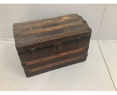 An Edwardian domed top trunk, width 77cm***CONDITION REPORT***PLEASE NOTE:- Prospective buyers are strongly advised to examin