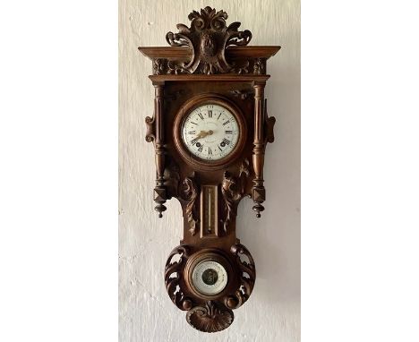 A late 19th century French carved walnut wall clock combined thermometer and barometer, dial and movement marked J Baptiste B
