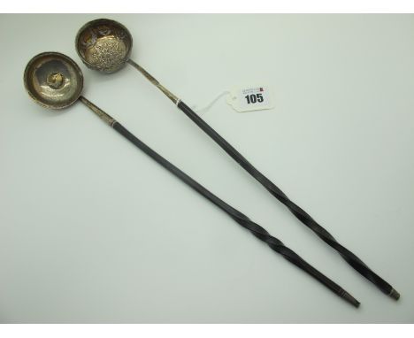 A Georgian Toddy Ladle, the circular bowl detailed in relief, with twisted handle, approximately 39cm long; together with ant