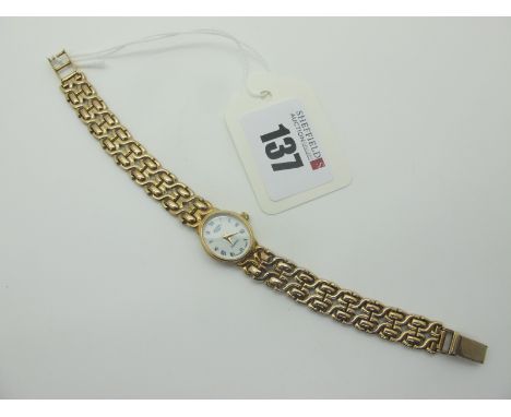 Rotary; A 9ct Gold Cased Ladies Wristwatch, the signed oval dial with blue Roman numerals, to integral bracelet with 9ct gold