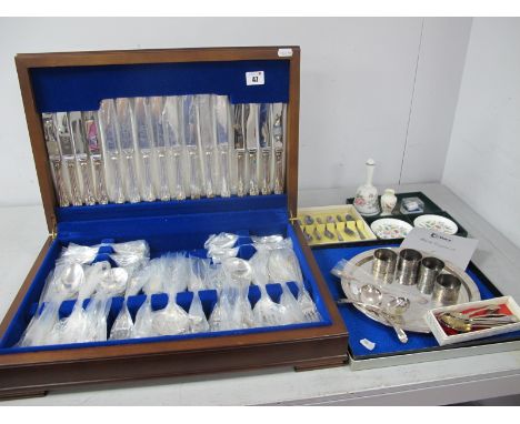 An Eight Setting Canteen of Plated Cutlery, in original fitted canteen case; together with four Aesthetic style napkin rings 
