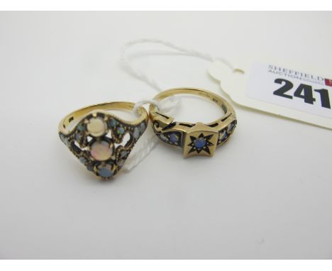 An Antique Style Set Gold Opal Dress Ring, of openwork design, claw set throughout (finger size O), another similar, with ins