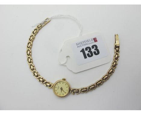 Rotary' A 9ct Gold Cased Ladies Wristwatch, the signed dial with line markers, to 9ct gold gate style bracelet (total weight 