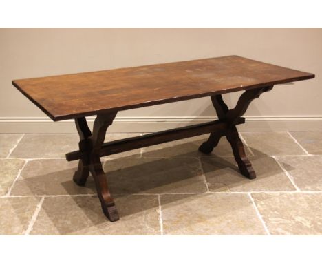 A 17th century style oak refectory table, mid 20th century, the slab top upon 'X' frame supports united by a cross stretcher,