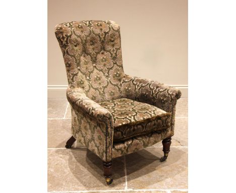 A late Victorian button back armchair, in the manner of Holland & Sons, the brass castor cups stamped 'Cope and Collinson pat