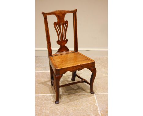 A George III elm country Chippendale style chair, the pierced vase shaped splat back over a board seat, front cariole legs ex