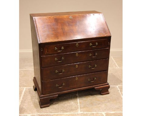 A George III mahogany and satinwood banded bureau, the fall front opening to a compartmented interior, the central door inlai