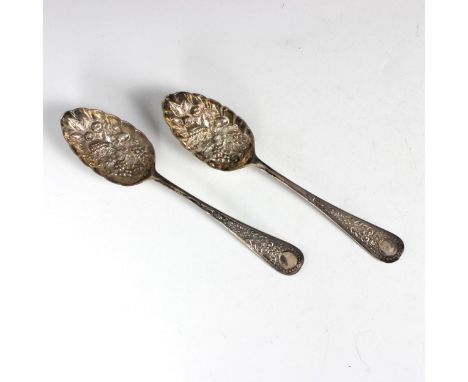 A pair of Victorian silver spoons, Walker &amp; Hall, Sheffield 1897, with later embossed berry decoration, 22cm long, gross 