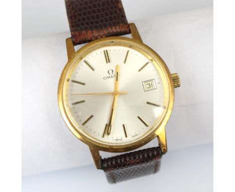 A gold plated Omega wristwatch, the silver coloured dial with baton markers and date aperture to 3 o’clock, set to plain poli