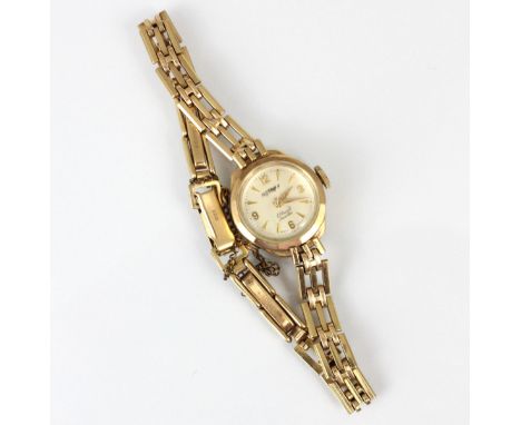A 9ct Rotary wristwatch, the white dial with Arabic numerals and baton markers, within 9ct plain polished case, 1.8cm wide (i