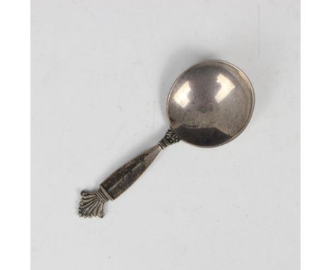 A Georg Jensen silver caddy spoon, with shaped terminal leading to plain polished bowl, stamped 'Georg Jensen sterling Denmar
