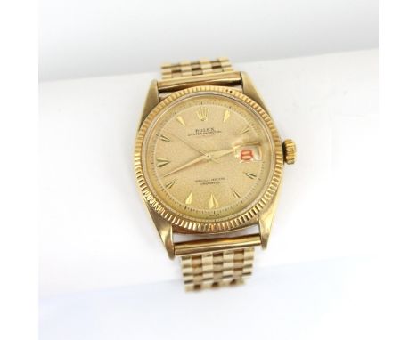 A mid 20th century 9ct Rolex Oyster Perpetual Datejust 'Red' wristwatch, ref: 6305, the circular patterned dial with arrow ma