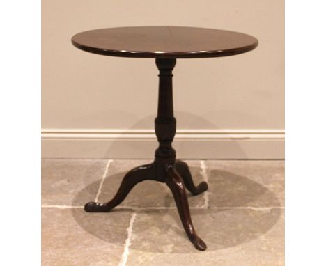 A George III mahogany tripod table, the circular top upon an urn and barrel turned pedestal, extending to three cabriole supp