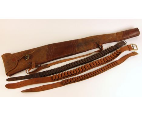 A leather double shotgun slip, of typical form with buckled flaps and carry strap, 120cm long, with three leather cartridge b