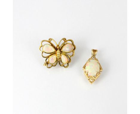 A yellow metal opal and diamond pendant, the oval opal cabochon within stylised yellow metal mount highlighted with round cut