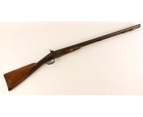 A percussion cap double barrel shotgun, 19th century, with 787mm (31") long 20mm bore Damascus barrels, and associated ram ro