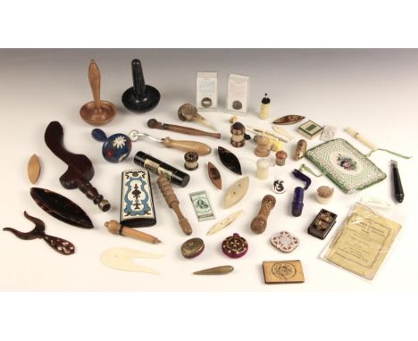 A selection of needlework and sewing accessories, 19th century and later, to include needle cases, tape measures, tatting shu