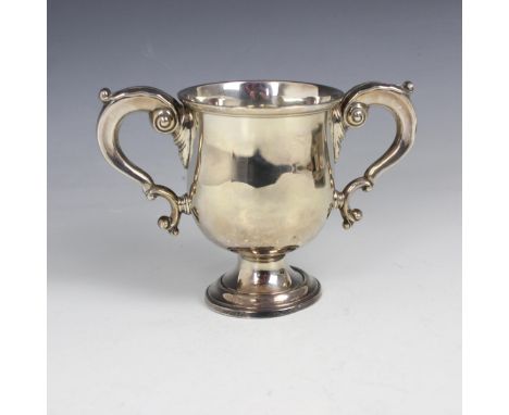 A George V silver trophy, Adie Brothers Ltd, Birmingham 1937, the leaf capped twin handles above plain polished body upon ped