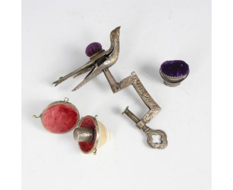 A 19th century novelty sewing clamp, designed as a bird with engraved detail throughout, pin cushion to reverse, 13cm long, w