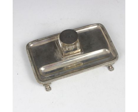 A George V silver desk tidy, ‘HW’ London 1914, the rectangular tray encompassing initialled silver mounted glass inkwell, and
