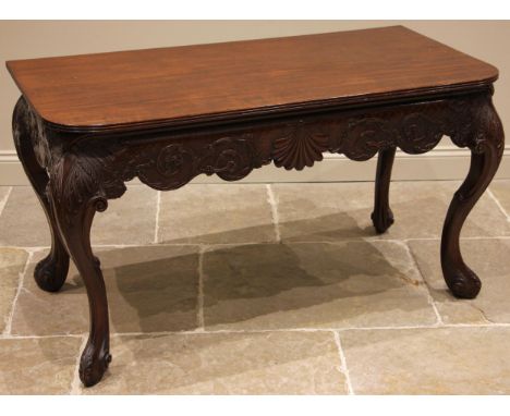 An Italian style mahogany console table, early 20th century, the D shaped top with a reeded edge over the shaped apron applie