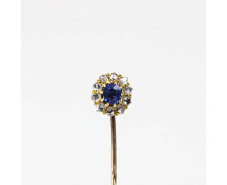 A 19th century diamond and untested sapphire stick pin, the central cushion cut sapphire within surround of rose cut diamonds