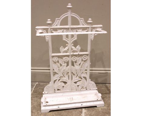 A Victorian cast iron Coalbrookdale stick stand, the angular stick retainer upon a cast floral open work back plate, over the