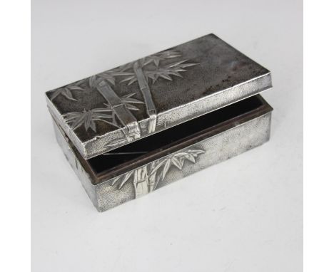 A 20th century Chinese white metal cigarette case, the rectangular case with all over bamboo decoration, stamped to base with