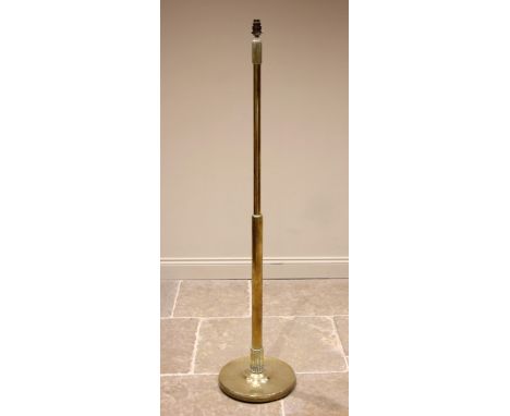 A late Victorian brass standard lamp, of cylindrical form, with a fluted collar to the top and base, upon a circular plinth, 