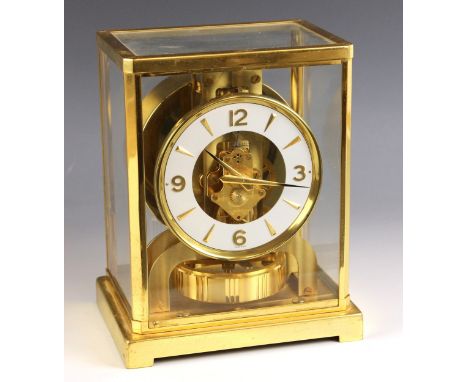 A gilt brass Jaeger-le-Coultre Atmos clock, serial number 266628, the white chapter ring applied with relief cast Arabic nume