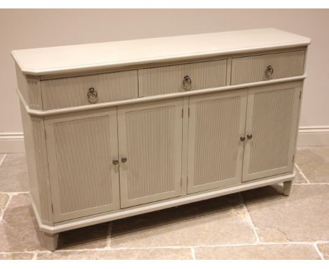 An Oka sideboard, in the Georgian style, finished in 'Fireplace Grey', formed with three ribbed frieze drawers over four conf