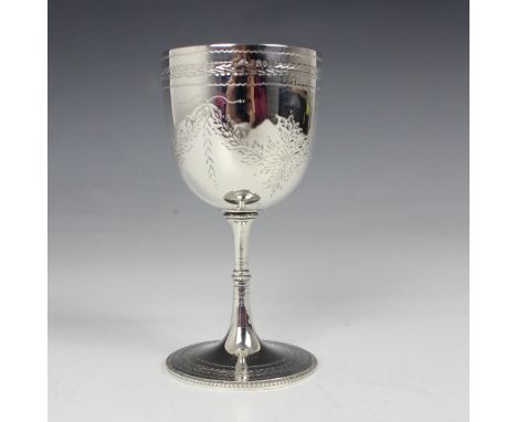 A Victorian silver goblet, possibly Thomas Smily, London 1864, the bright cut engraved decoration with garland detailing, wit