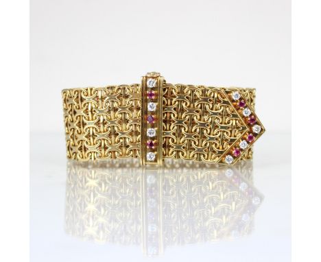 A mid/late 20th century yellow metal diamond and ruby bracelet, the chain mail style links leading to arrow shaped terminal s