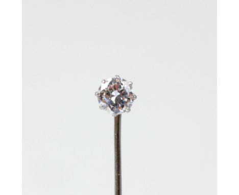 An early 20th century diamond stick pin, the central old cut diamond in white metal claw setting edge, leading to white metal