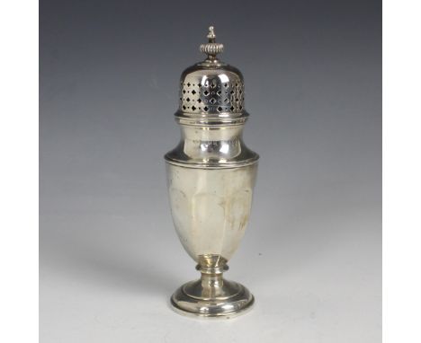 A George V silver sugar caster, Adie Brothers Ltd, Birmingham 1931, the pierced pull off cover above faceted body, upon pedes