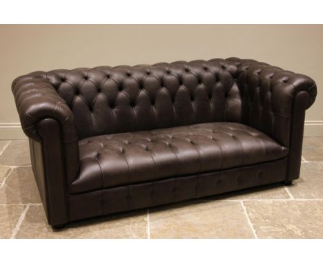 A nut brown leather Chesterfield sofa, late 20th/early 21st century, of typical deep set form, with button back scrolled back