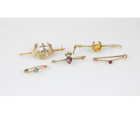 A selection of yellow metal brooches, including an Edwardian style crowned heart amethyst example, stamped '9' 3.5cm wide, a 