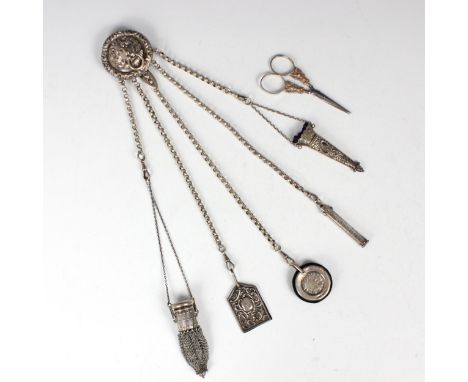 A Victorian silver five strand chatelaine, George Unite, Birmingham 1870, the circular lions masks designed clip suspending a