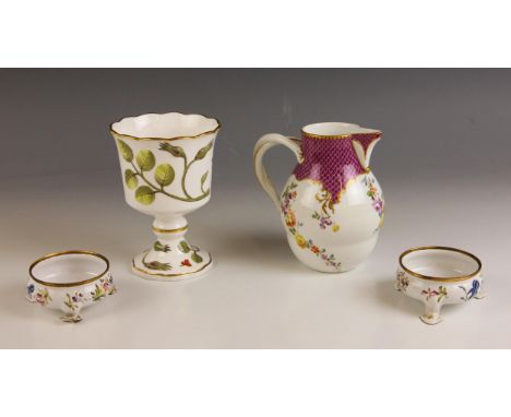 A porcelain entwined handle jug, 19th century, of waisted baluster form with stylised floral motif to the spout, acanthus lea