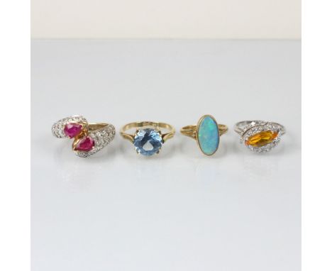 A selection of four dress rings, including a 9ct ruby and diamond ‘toi et moi’ dress ring, ring size O, a diamond dress ring,