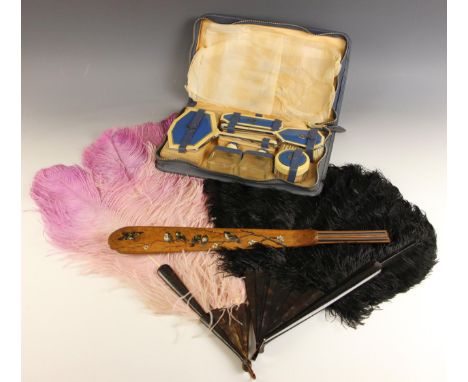 A selection of early 20th century ladies accessories, including a black peacock feather fan, with faux tortoiseshell guards, 