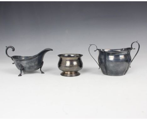 An Edwardian silver sugar bowl, John Rose, Birmingham 1909, the twin scroll handles above tapered shaped body, 9.5cm high, wi