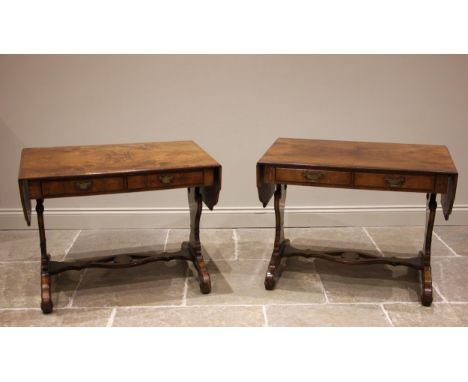 A near pair of Regency style walnut sofa tables, early to mid 20th century, each table with a quarter veneered and cross band