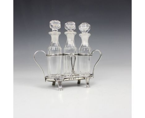 A George III silver triple condiment stand, Robert Hennell I &amp; David Hennell II, London 1801, the twin handles with reede