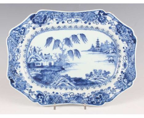 A Chinese blue and white export porcelain meat dish, Qianlong period, with shaped rim, painted with pavilion, pagoda and tree