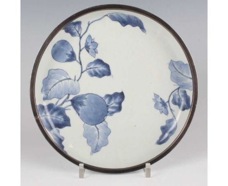 A Kakiemon style blue and white porcelain saucer dish, Edo period, circa 1700, of shallow circular form, the interior painted