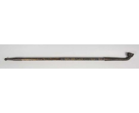 A Chinese opium pipe, probably 20th century, the telescopic shaft damascened with gilt flowers, fully extended length 66cm.